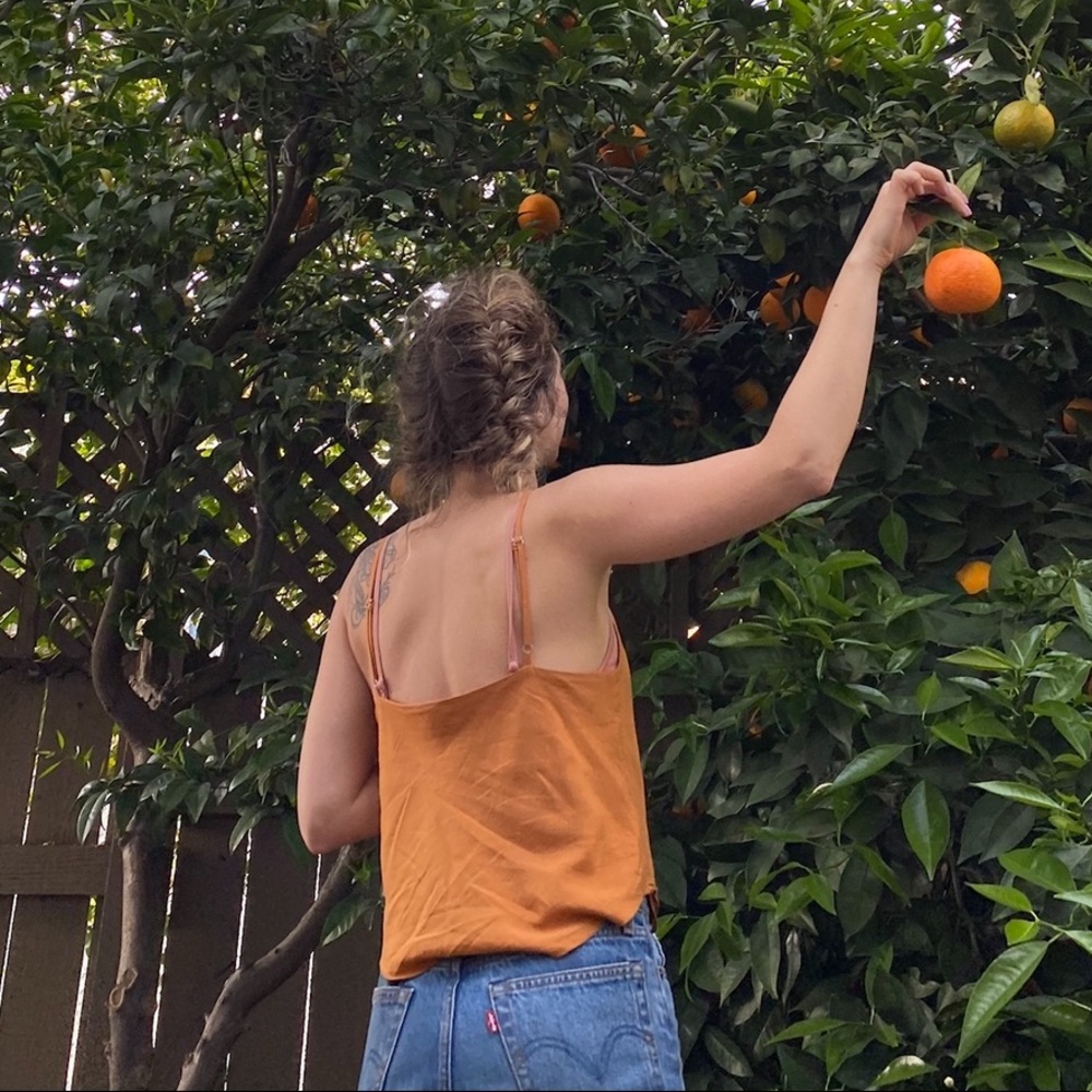 Super cute camisole/tank with double layer in front. Size S/M